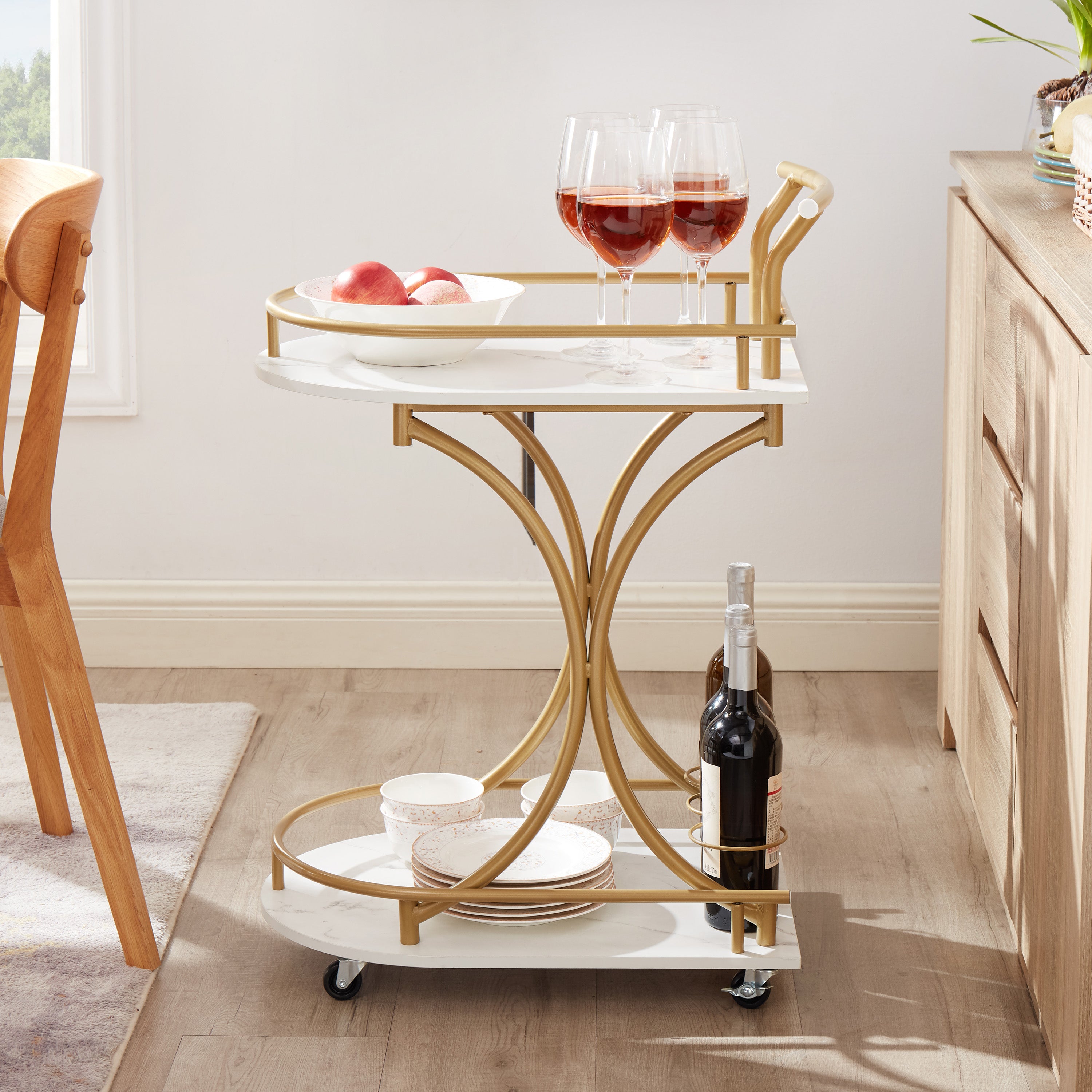 Golden double-tier bar cart with stemware rack, white shelves, and rolling casters