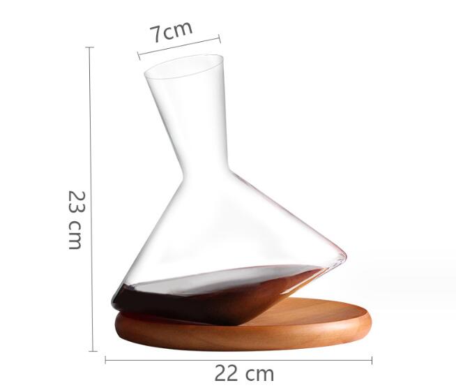 Crystal wine decanter with wooden base, 22 cm wide and 23 cm tall