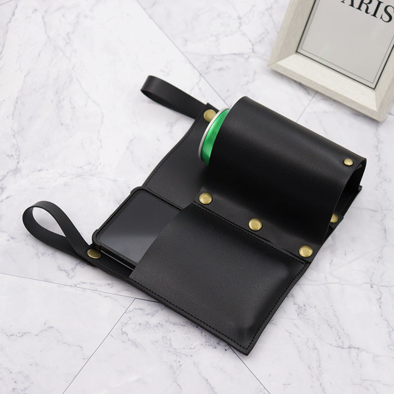 Black camping chair side storage bag with phone pocket and green trim ring