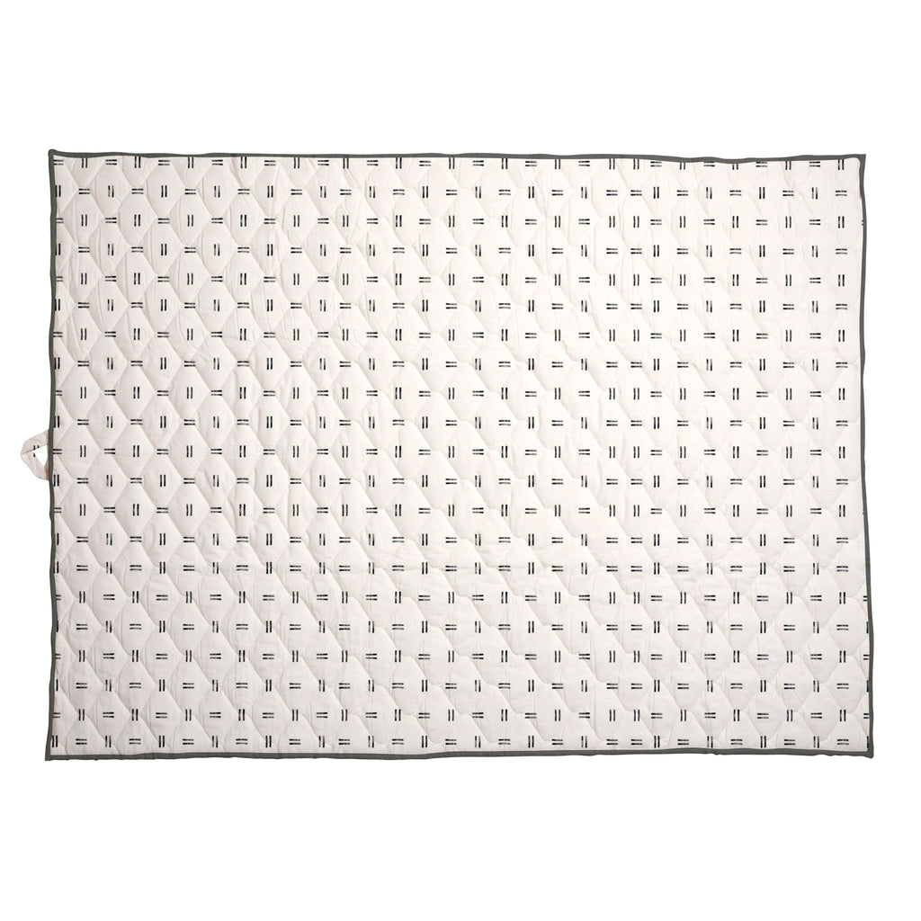 Extra-large waterproof picnic blanket laid flat, off-white with repeating black mudcloth pattern