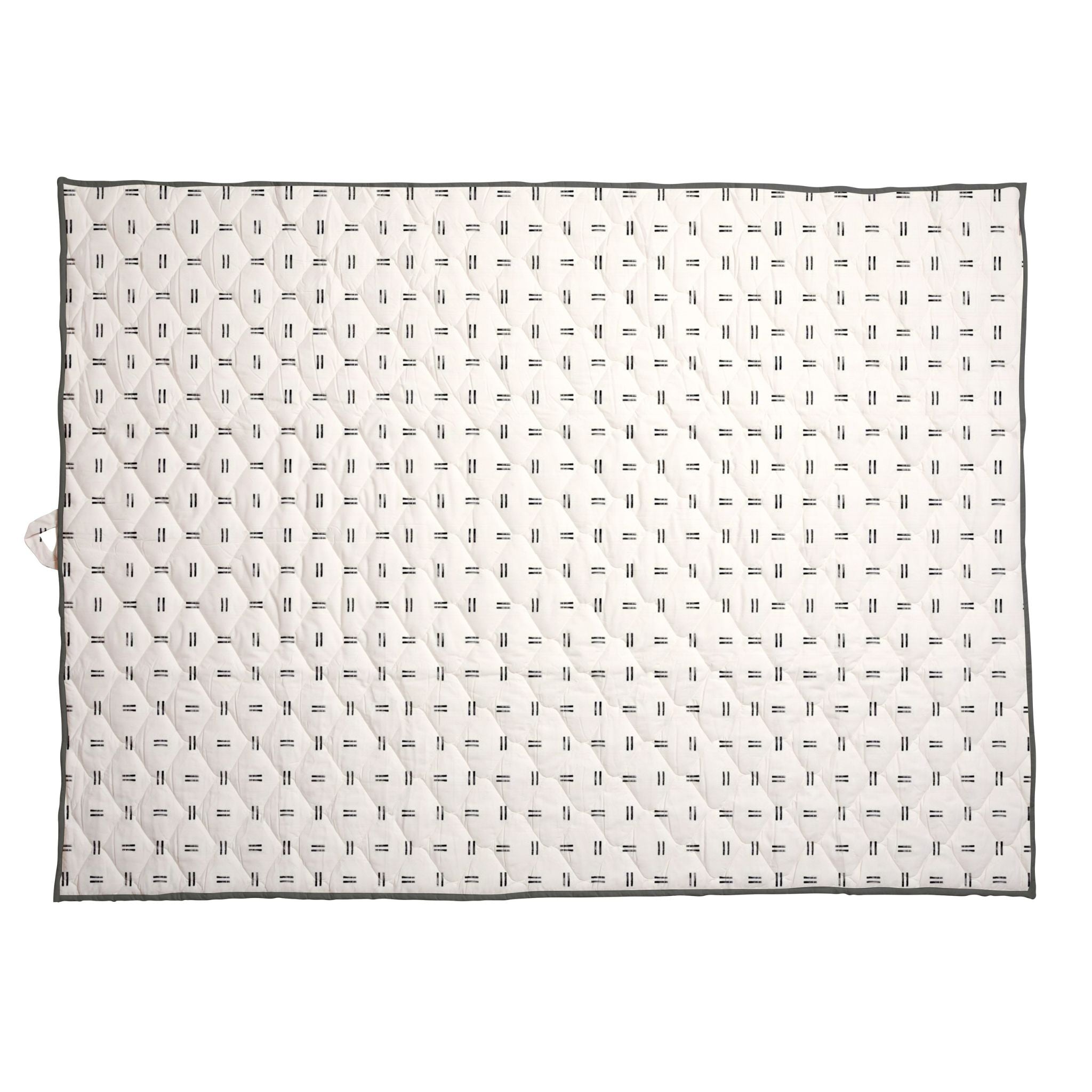 Extra-large waterproof picnic blanket laid flat, off-white with repeating black mudcloth pattern