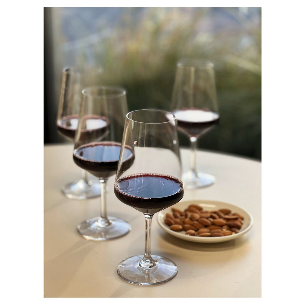 Clear stemmed wine glasses with dark red wine, set of four, 19oz each