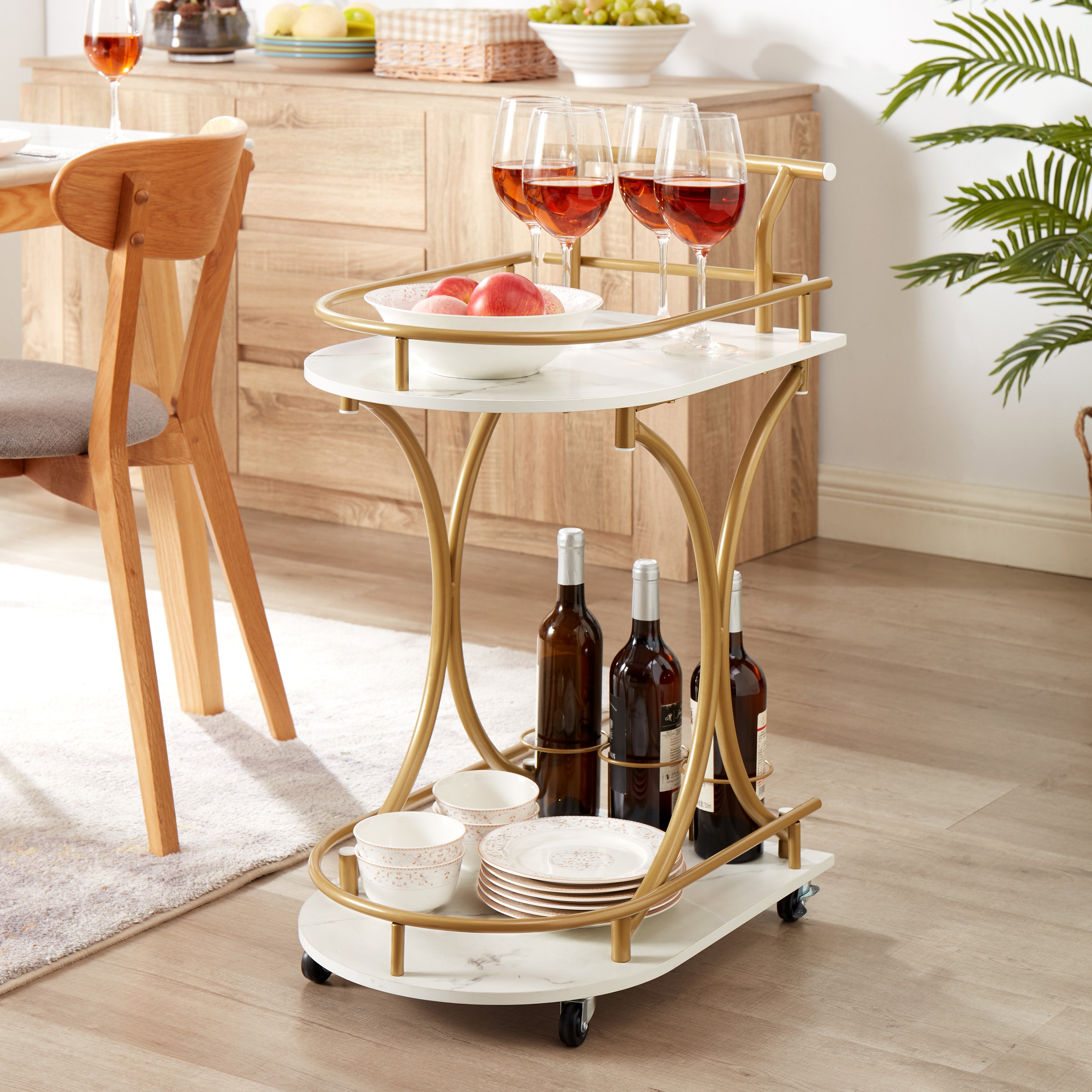 Golden double-tier rolling bar cart with stemware rack and white marble-look shelves
