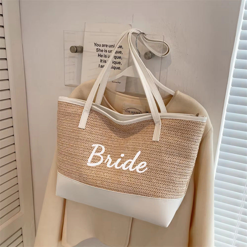 Light khaki woven tote bag with white bottom and 'Bride' print, double handles
