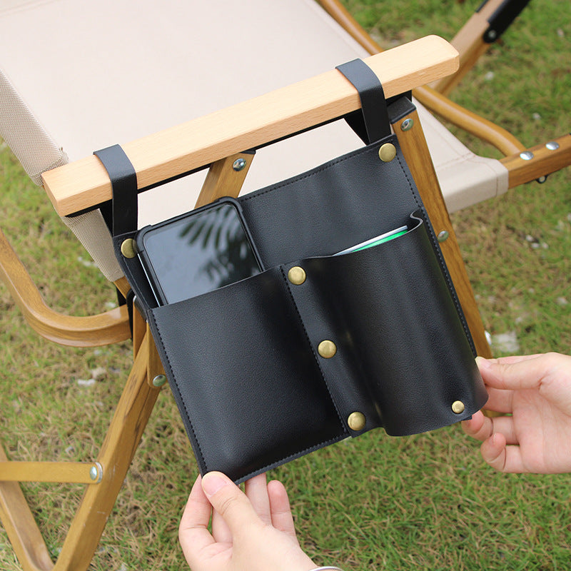 Black camping chair side storage bag with front phone pocket and inner divider