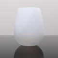Foldable silicone wine cup, white, standing upright with smooth sides