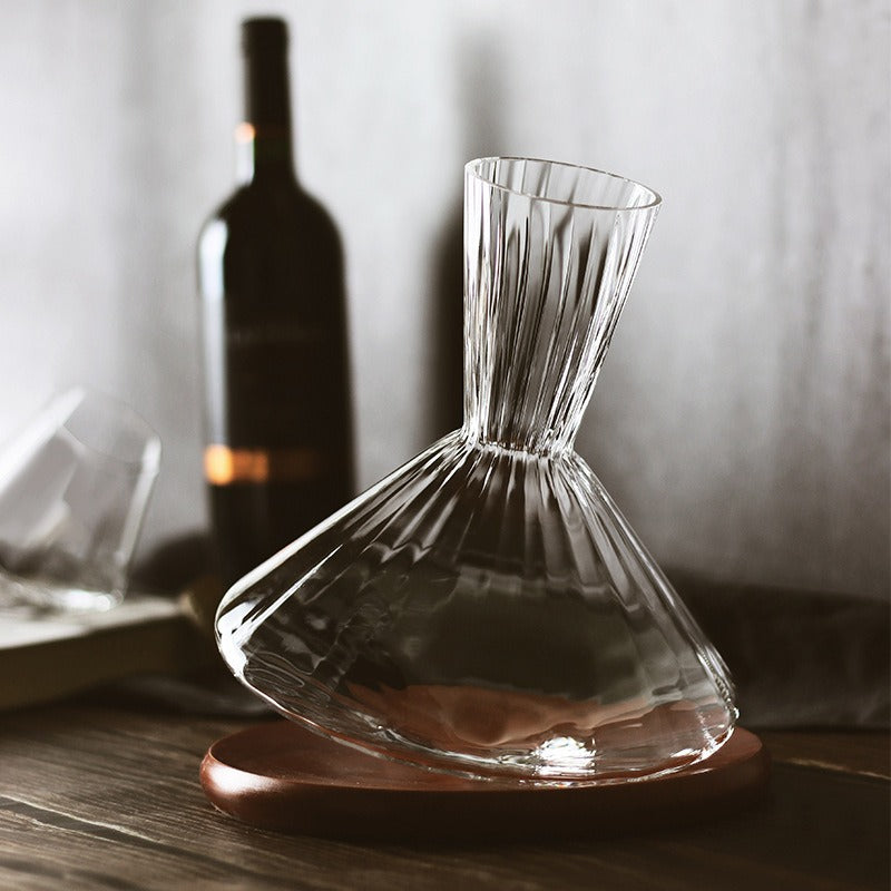 Crystal wine decanter with tall ribbed neck and wooden base, clear glass