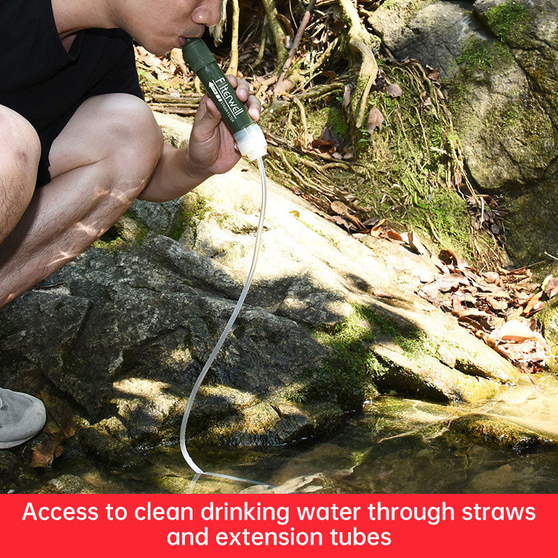 Green water filter pipet with tube held over stream water by hands