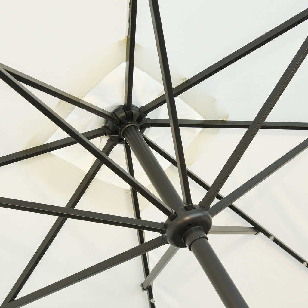 Black umbrella rib frame hub with cross braces under a white canopy