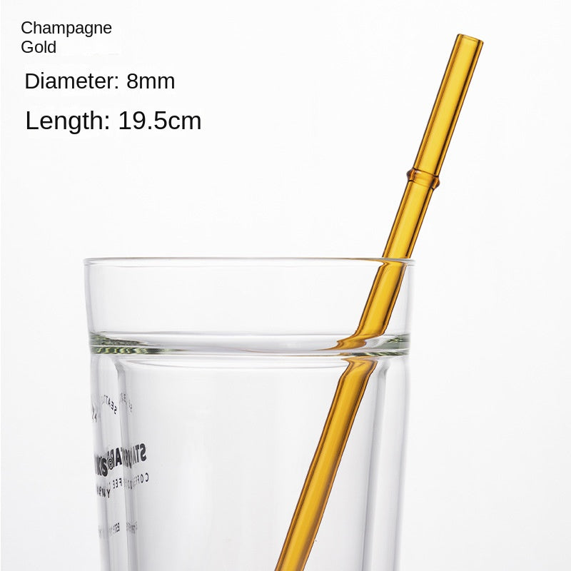 Champagne gold borosilicate glass drinking straw in a clear cup