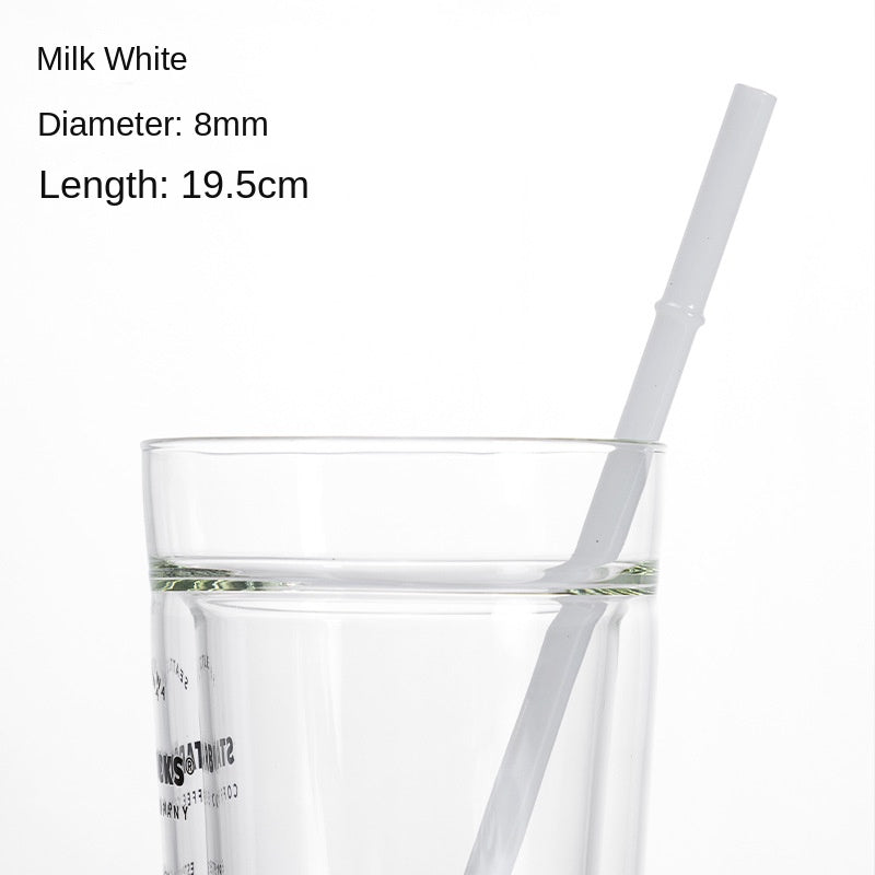 Milk white borosilicate glass drinking straw in a clear cup