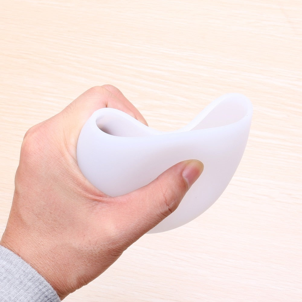 Foldable silicone wine cup, white, folded design held by hand