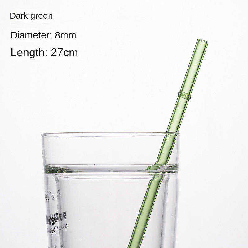 Dark green borosilicate glass drinking straw, 8mm diameter, 27cm long, in a glass