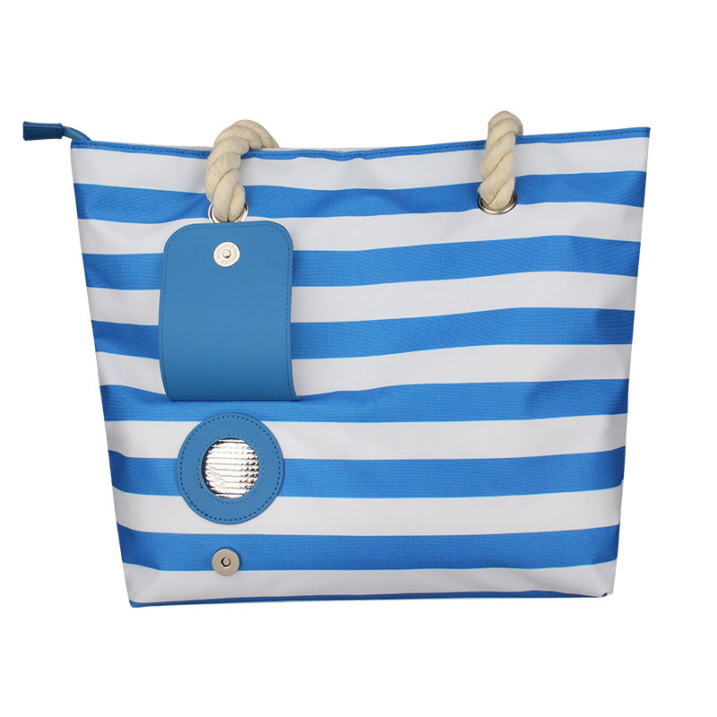 Blue-and-white striped insulated tote bag with rope handles and front blue accessory pocket.