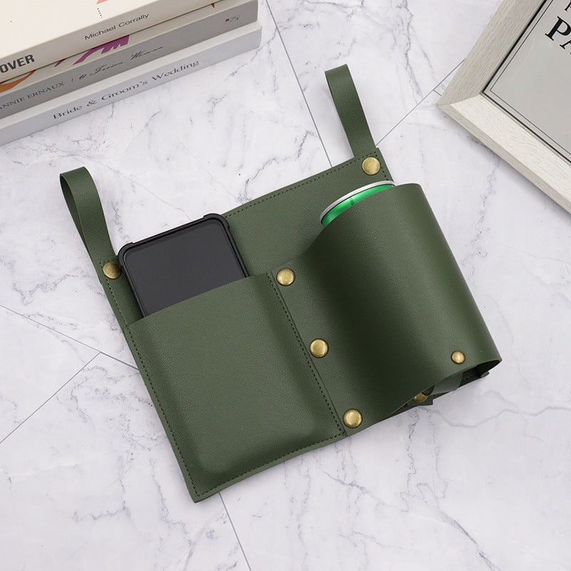 Green leather-look chair organizer with phone pocket and brass snap buttons