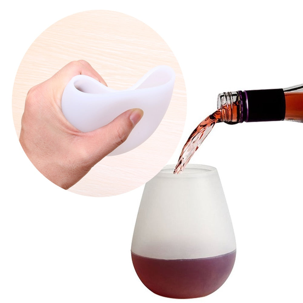 Foldable silicone wine cup, white, collapsed by hand with wine pouring