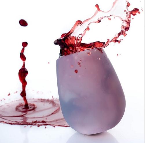 Foldable silicone wine cup, light purple, with wine splash on rim