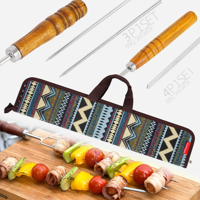 Barbecue fork set with wooden-handled forks on skewered vegetables, in fabric case