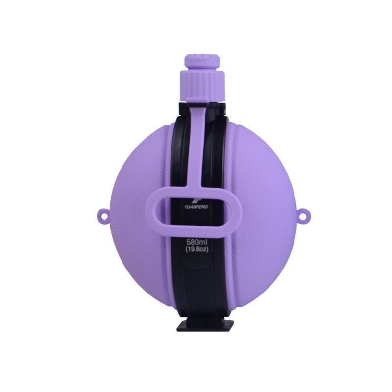 Purple 580ml folding silicone water bottle with black holder, spout, and side carry loops