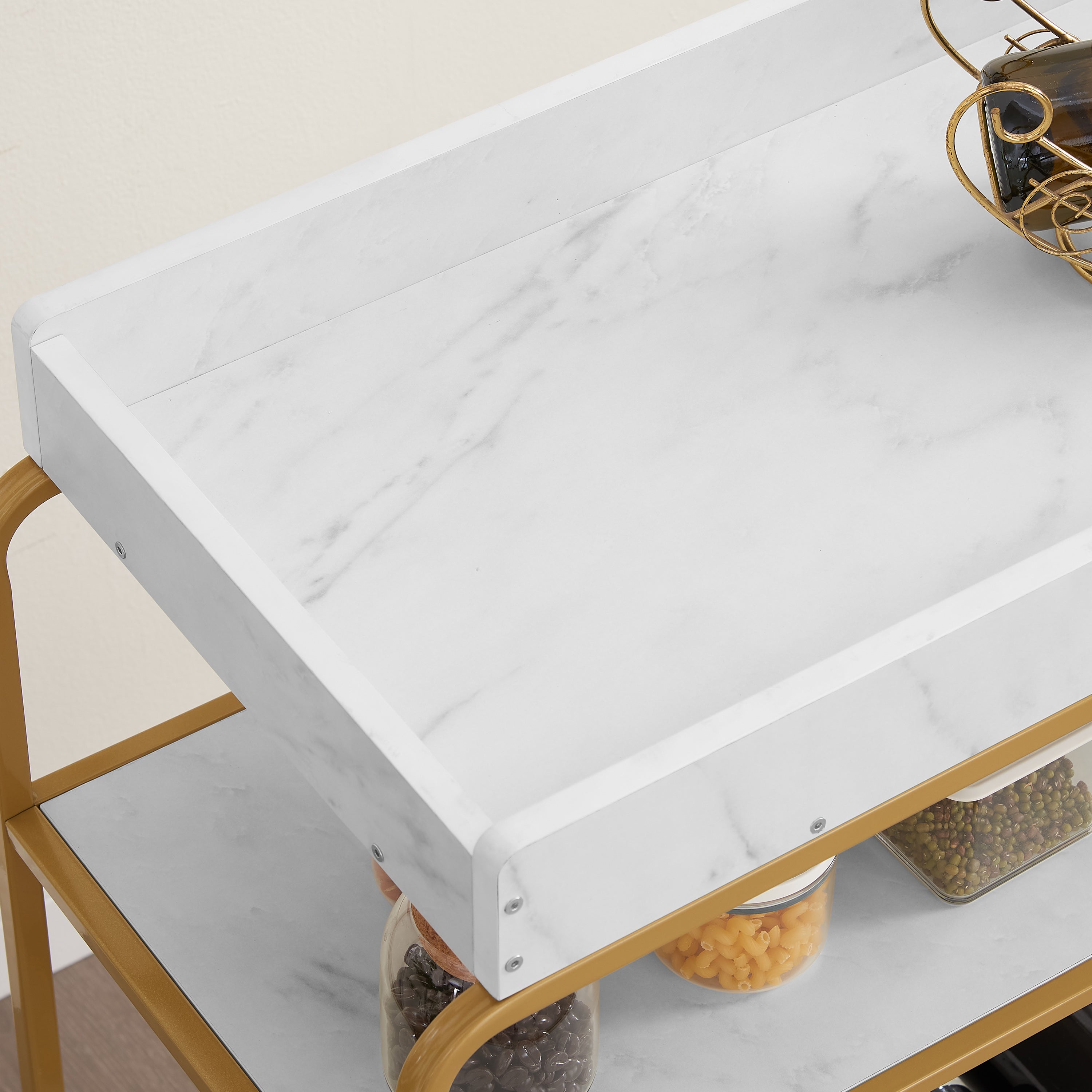 White marble-look top on a gold 6-tier bar cart with rounded metal corner frame