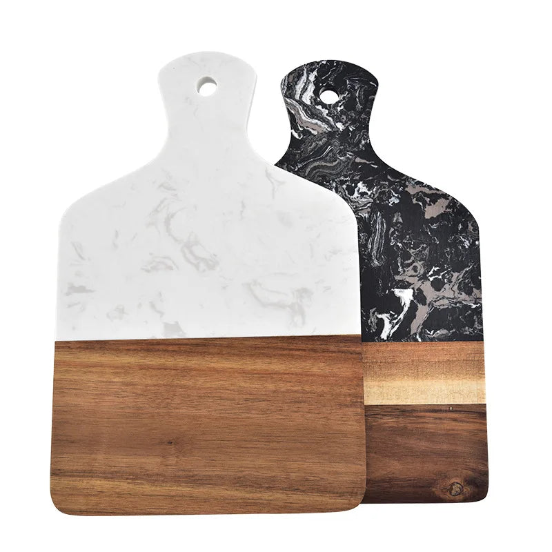 Marble and acacia cutting boards, white and black stone faces with brown wood inlay