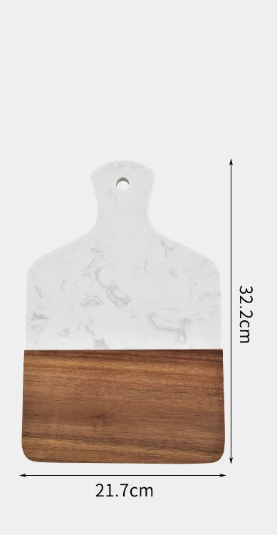 Marble and acacia wood cutting board with white stone face, brown wood bottom, hanging hole