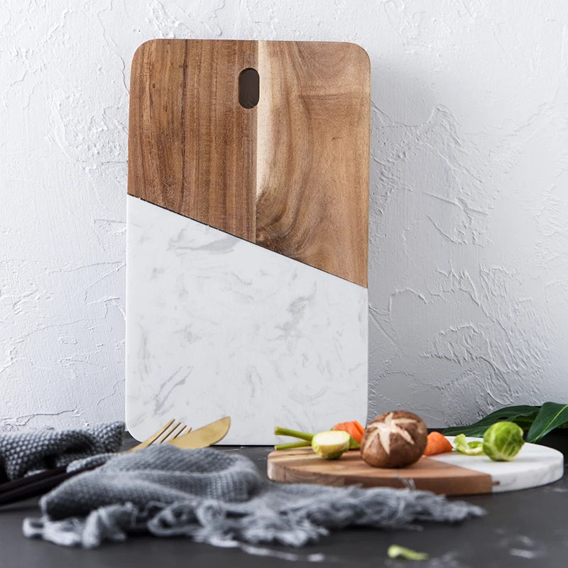 Marble and walnut serving board with cutout handle, two-tone wood panel design