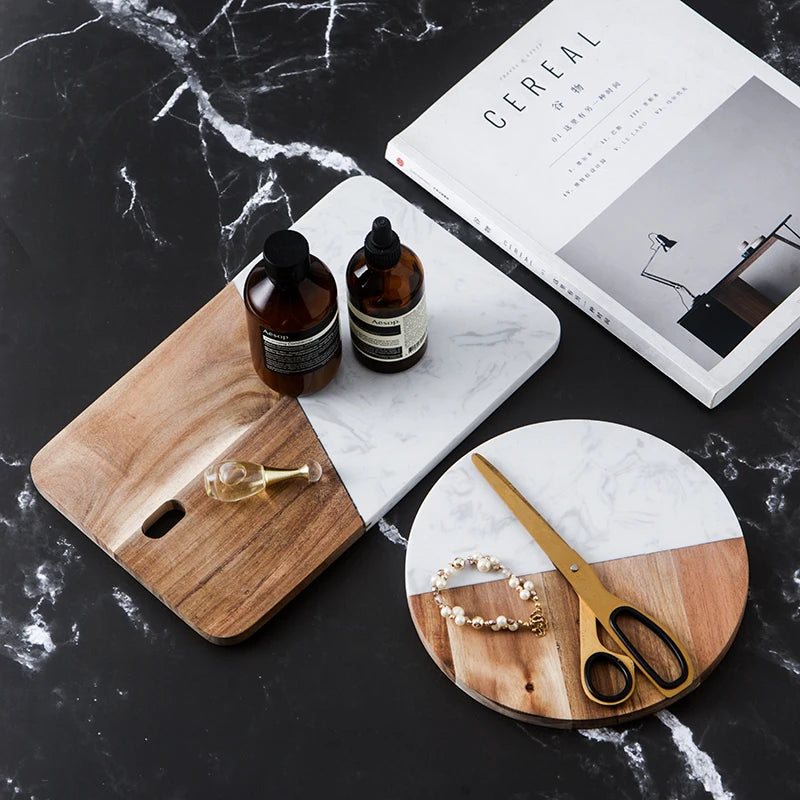 Wood-and-marble cheese board set with cutout handles, including a round board