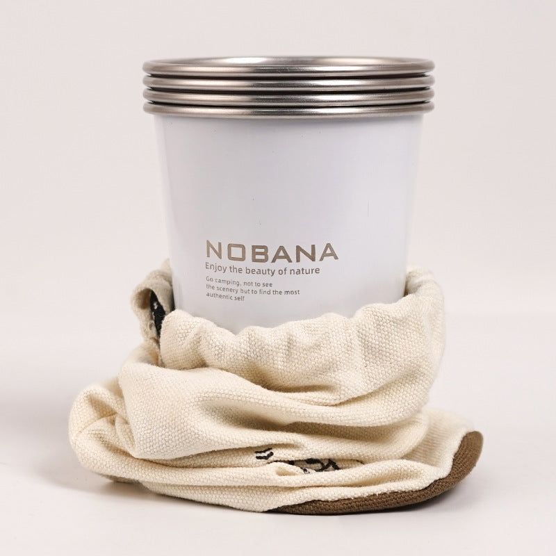 White stainless steel camping cup with metal rim, wrapped in a beige storage sleeve