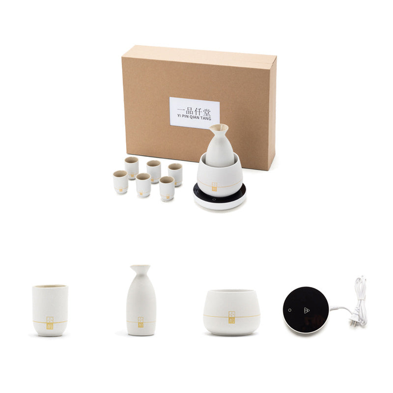 Ceramic electric wine warmer set with heating base, bottle warmer, cups, and power cord