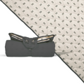 Extra-large waterproof picnic blanket, off-white with repeating black mudcloth pattern, folded